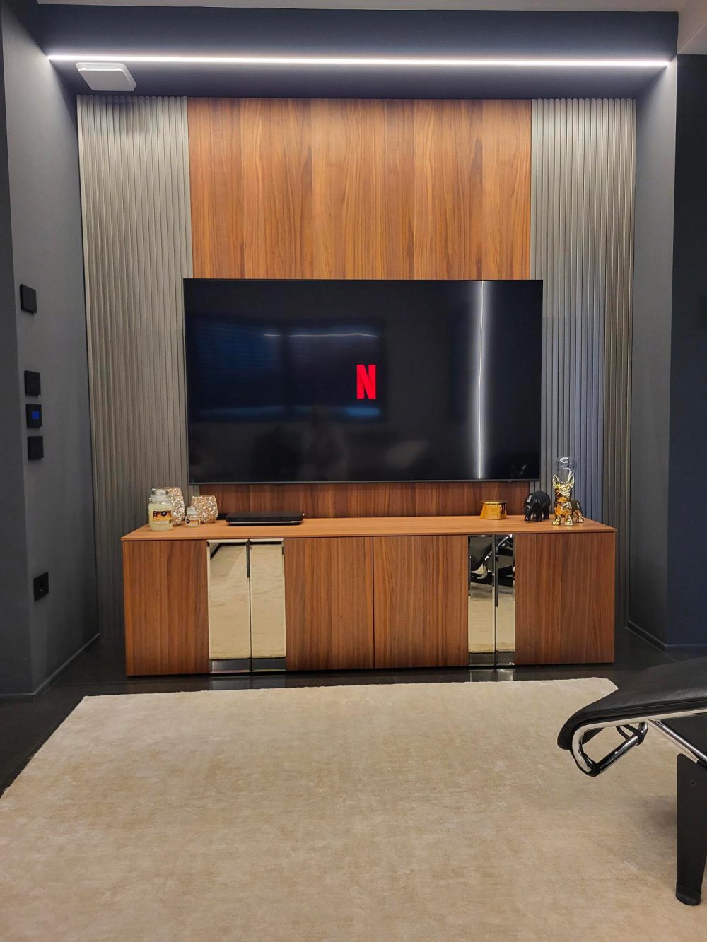 Living area featuring bold design with black lacquer and faded gold surfaces.